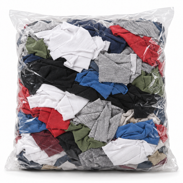 Bolsa transparente de 1 kg con paños cortados de polera de algodón en colores surtidos, sobre fondo blanco. SKU 730139RTF. Foto referencial.